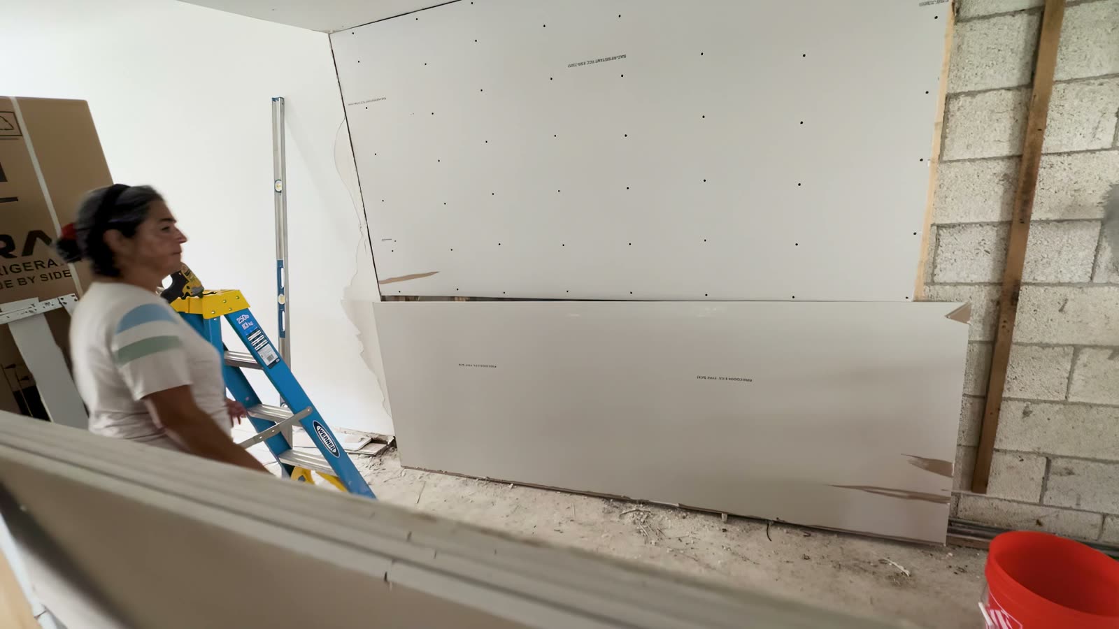 Interior rebuild: new drywall going up inside the home