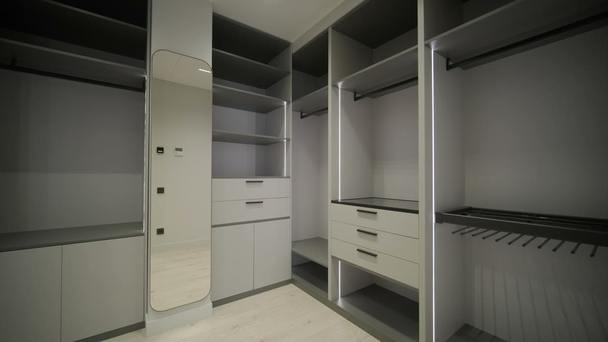 A built-in wardrobe with drawers