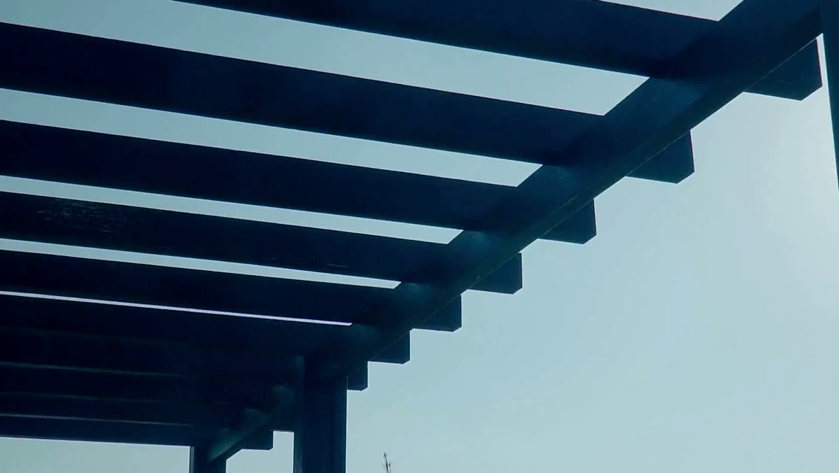 Pergola beams against the sky